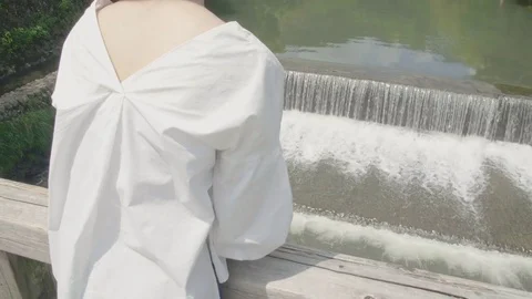 Overlooking beautiful river and small waterfall in Arashiyama Kyoto Japanese  Stock Footage 76541228