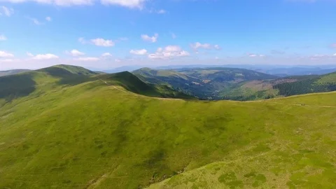 Overlooking with covered of grass mountains. aerial view Stock Footage 79072055