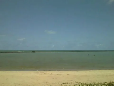 Overlooking the distant beach, can see the fishermen in the middle of the sea Stock Footage 162147525