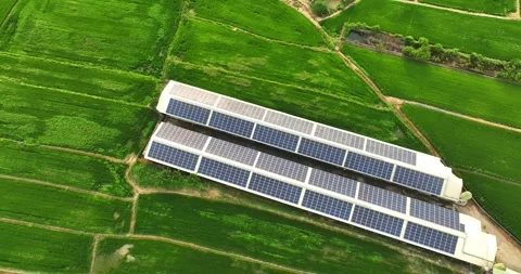 Overlooking farm paddy fields and solar farms Stock Footage 257041600