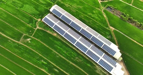 Overlooking farm paddy fields and solar farms Stock Footage 257041847