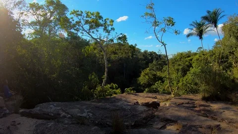 Overlooking of forest and the sun rays from top of waterfall. Stock Footage 115095452