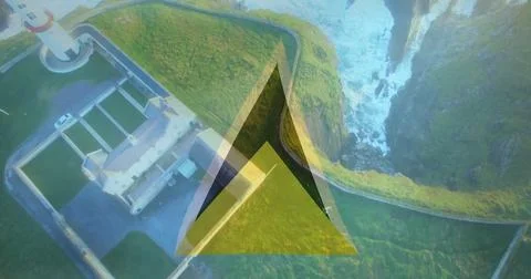 Overlooking lighthouse complex on coastal cliff top with triangular graphic Stock Photos