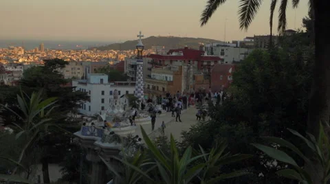 Overlooking monumental zone of Parc Guell Barcelona at sunset, pan slo-mo. 库存影片 63103172