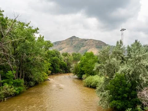 Overlooking muddy waters running through downtown Golden, Colorado. Stock Photos