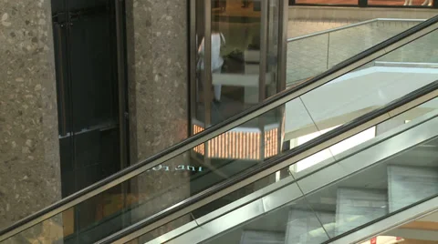 Overlooking railing at elevators and escalators within mall (2 of 3) Stock Footage 32326982