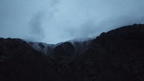 Overlooking snow mountains Stock Footage 101187046