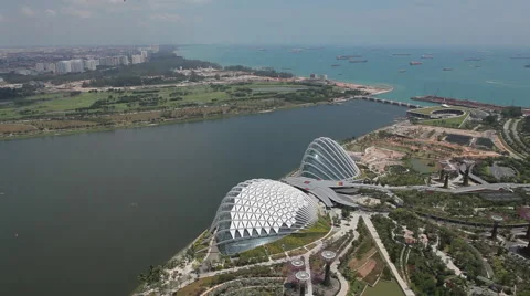 Overlooking view of Gardens by the Bay with cargo boats in background Stock Footage 50027262