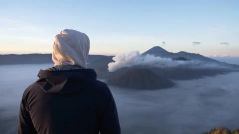 Overlooking volcanic landscape of active volcano Mount Bromo in morning light Stock Footage 174907461