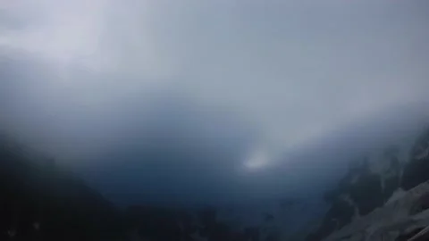 Overnight time lapse of snowy mountain peaks and ridge. Scenic landscape of Stock Footage 169706033