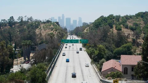 From overpass overlooking freeway and downtown los angeles skyline 스톡 동영상 112757025