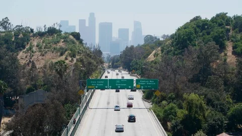 From overpass overlooking freeway and downtown los angeles skyline 스톡 동영상 112758662
