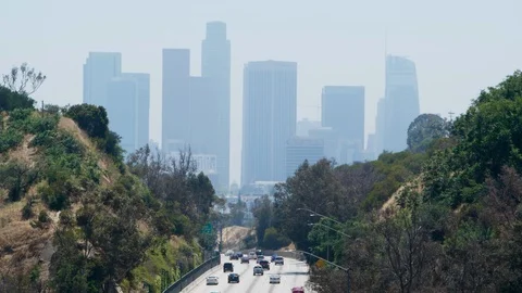 From overpass overlooking freeway and downtown los angeles skyline 스톡 동영상 112760758
