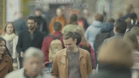 Overpopulation. A crowd of people walking down the street . Slow motion. Stock Footage