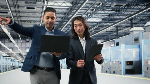 Overseeing automated systems, semiconductor factory and multiethnic managers Stock Footage 333392600