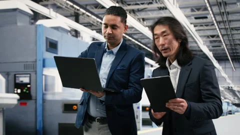 Overseeing automated systems, semiconductor factory and multiethnic managers Stock Footage 333394936