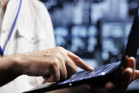 Overseeing manager examining servers 스톡 사진