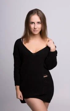Oversize model posing in black sweater Stock-Fotos
