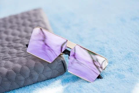 Oversized sunglasses model with pink flat lenses shoot outside in a sunny day Stock Photos