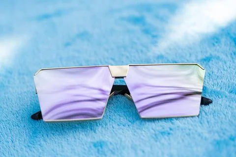 Oversized sunglasses model with pink flat lenses shoot outside in a sunny day Stock Photos
