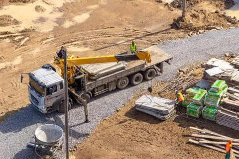 Oversized truck with an extended loading platform and loader crane for loading Stock Photos