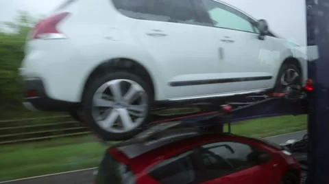 Overtaking car transporter lorry driving on motorway in england Stock Footage 37865222