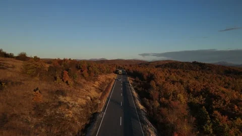 Overtaking traffic car vehicles drive aerial drone view in autumn day Stock Footage 220097344