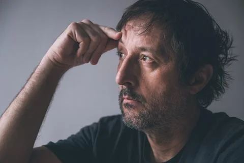 Overthinking and analysis paralysis concept, portrait of pensive unkempt ma.. 写真素材