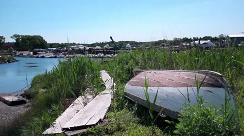 Overturned boat in grassy shipyard Stock-Footage 60951050