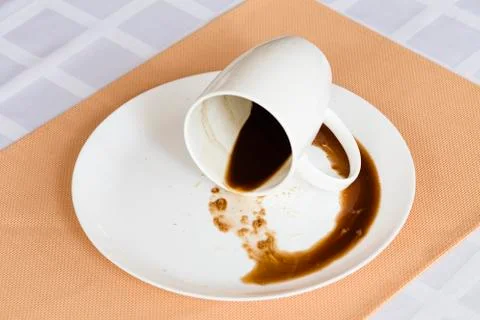 Overturned cup with the coffee. Stock-Fotos
