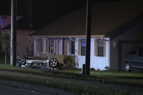 Overturned vehicle in front lawn wide Video stock 822453