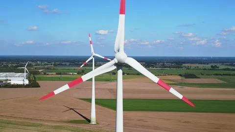 Overview 100 meter high wind turbine. Buttery soft aerial view flight havelland Stock Footage 220494706
