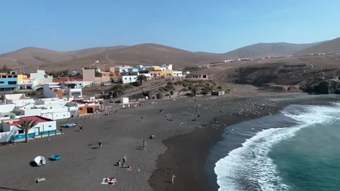 Overview of Ajuy black sandy beach from the coast path Stock Footage 239928225