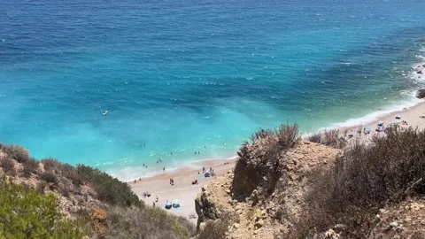 Overview on the Cala Moraig in the Calpe area, a stunning beach known for its cr Stock Footage 278427076