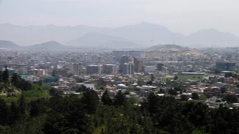 Overview of the city surrounded by mountains Stock Footage 106286858