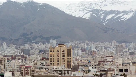 Overview of the city Tehran with the Mountains behind Stock Footage 336061375