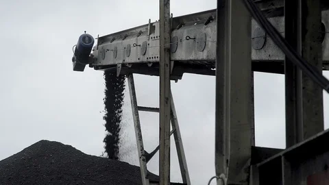 An overview of a coal dispenser forming a huge pile of coal Stock Footage 101505425