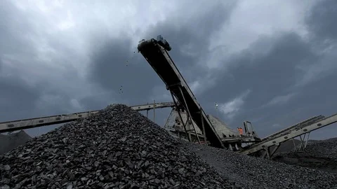 An overview of a coal falling from the belt conveyor at the coal mine Stock Footage 101503940