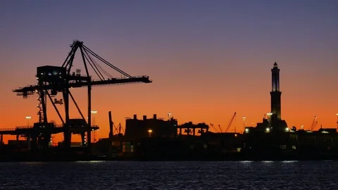 Overview with Cranes and Lantern of Genoa at sunset Vídeos de archivo 123066679