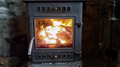 Overview of a fire inside a log burning stove with flames and glowing embers Stock-Footage 265147540