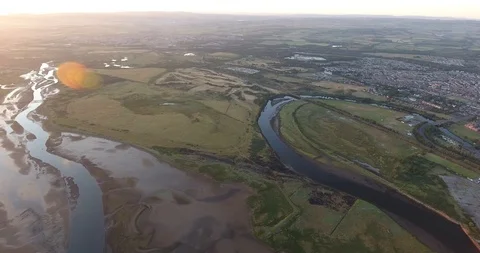 Overview of Flat Scottish Scenery with a Delta and Water at Sunset Stock Footage 97527152