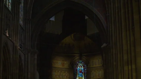 Overview of gothic cathedral interior with stained-glass windows, massive aches Stock Footage 315364660