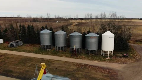 Overview of Grain elevators in Alberta, Canada at sunset. Agricultural Stock Footage 171581301