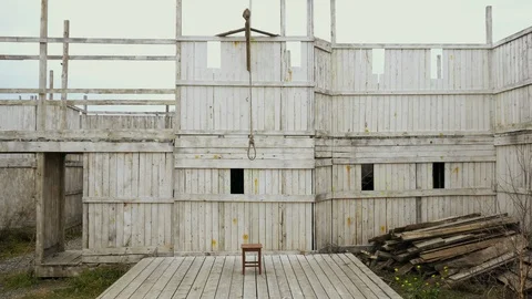 Overview hangman gallow with loop durable rope for suicide wooden background 4K. Stock Footage 118153619