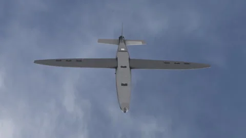 Overview of Hornet Kamikaze Fixed Wing AI-Assisted Drone Flying in Blue Sky 스톡 동영상 342307019