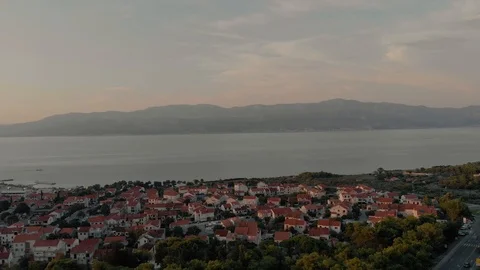 Overview of houses on an island in the sunset in 4k Stock Footage 97743653