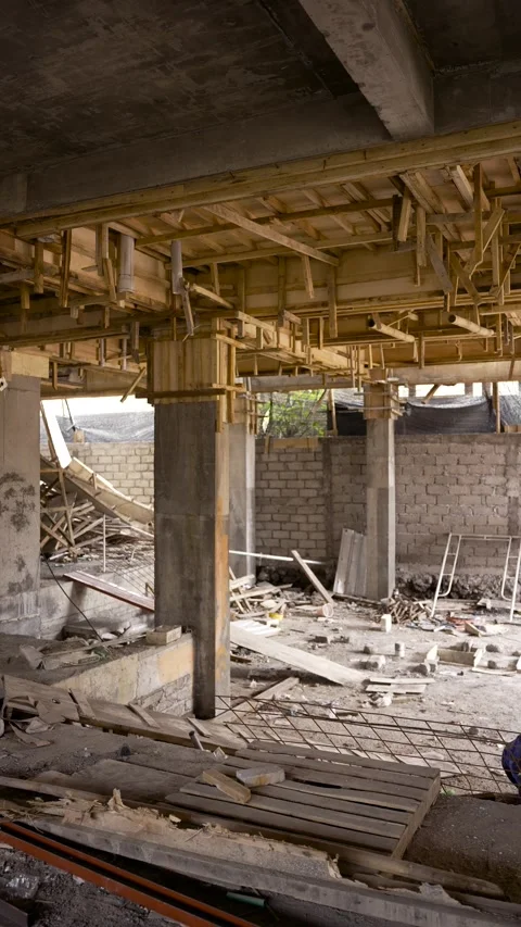 Overview inside building under construction with scaffolding, wooden beams Video stock 271078337