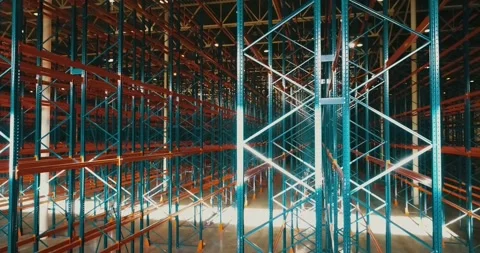 Overview inside warehouse. Sun reflections on metal. Rows of metallic frameworks Stock Footage 135130872