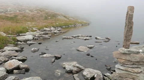 Overview of a lake with a monolith Stock Footage 54340826