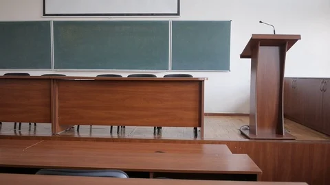 Overview lecture hall with large blackboard, microphone and podium for speeches Stock Footage 70370812